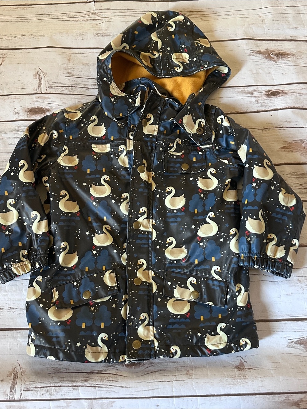 Little green radicals raincoat with white swans